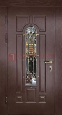 Темная железная дверь со стеклом и ковкой для частного дома ДСК-156 в Павловском Посаде